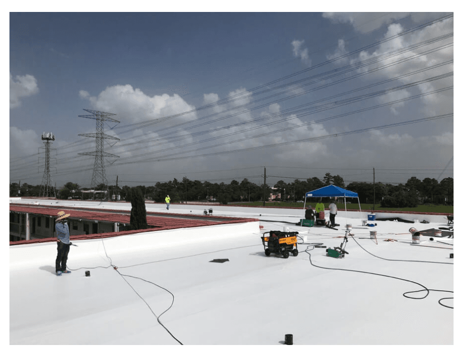 Commercial building roofscape — TPO, PVC, EPDM, and modified bitumen systems; exact membrane and attachment per manufacturer details